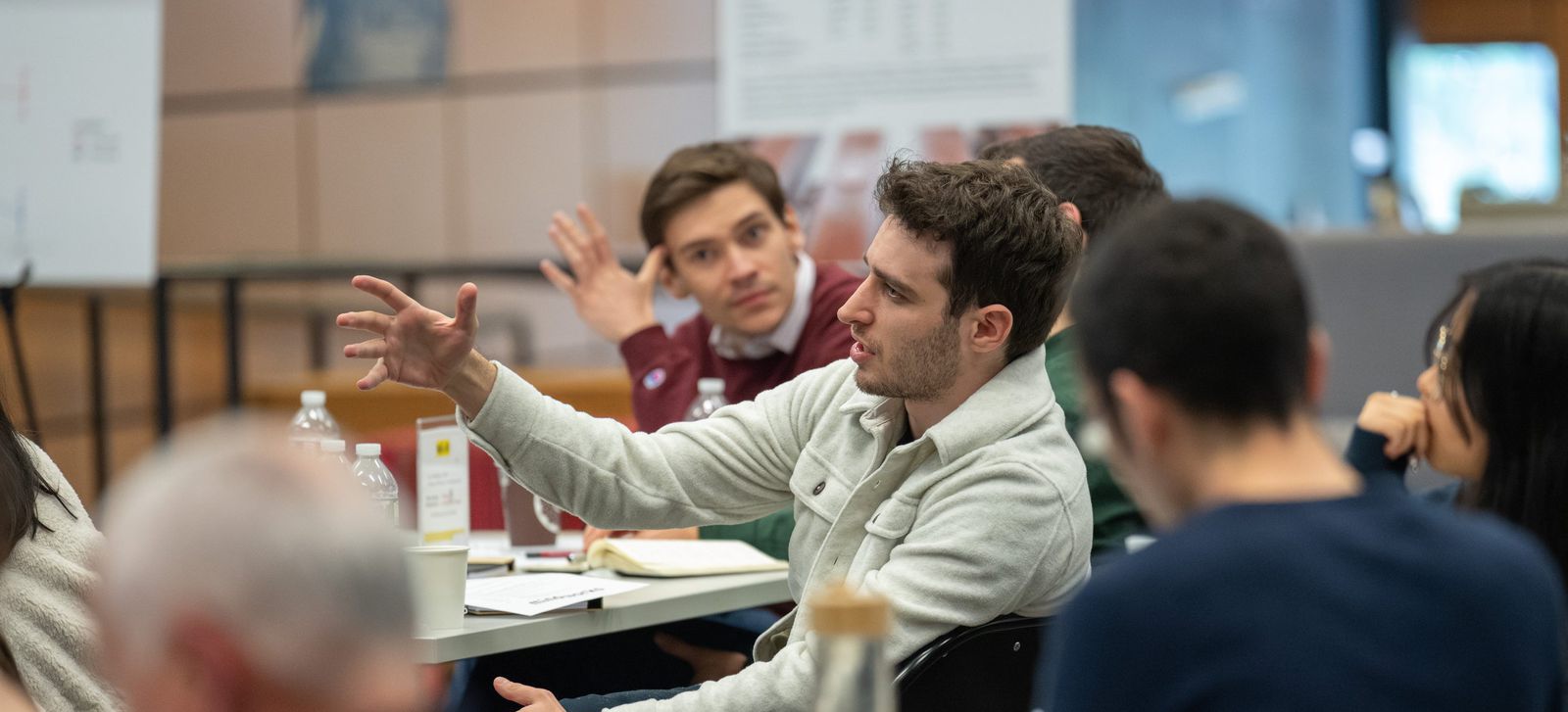 Ugur Mert Yasar speaking in a group discussion at the Center for Decision Research